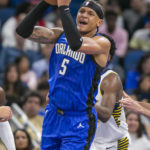 
              Orlando Magic forward Paolo Banchero (5) looks to pass the ball during the first half of an NBA basketball game against the Indiana Pacers, Saturday, Feb. 25, 2023, in Orlando, Fla. (AP Photo/Alan Youngblood)
            