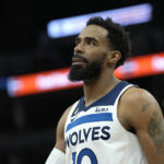 
              Minnesota Timberwolves guard Mike Conley looks down the court during the first half of an NBA basketball game against the Washington Wizards, Thursday, Feb. 16, 2023, in Minneapolis. (AP Photo/Abbie Parr)
            