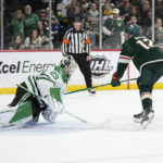 
              Minnesota Wild left wing Matt Boldy (12), right, shoots and scores a goal past Dallas Stars goaltender Jake Oettinger (29) during a penalty shoot-out of an NHL hockey game Friday, Feb. 17, 2023, in St. Paul, Minn. (AP Photo/Abbie Parr)
            