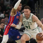 
              Boston Celtics forward Blake Griffin (91) drives to the basket against Detroit Pistons guard Killian Hayes (7) during the first half of an NBA basketball game, Wednesday, Feb. 15, 2023, in Boston. (AP Photo/Charles Krupa)
            