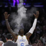 
              Los Angeles Lakers forward LeBron James tosses powder in the air prior to an NBA basketball game against the Golden State Warriors Thursday, Feb. 23, 2023, in Los Angeles. (AP Photo/Mark J. Terrill)
            