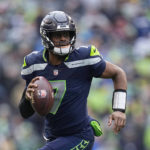 
              FILE - Seattle Seahawks quarterback Geno Smith (7) runs with the ball during the first half of the team's NFL football game against the Los Angeles Rams, Jan. 8, 2023, in Seattle. New York Giants running back Saquon Barkley, 49ers running back Christian McCaffrey and Smith are the finalists for AP Comeback Player of the Year. (AP Photo/Abbie Parr, File)
            