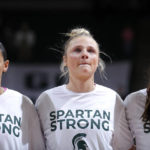 
              Michigan State players Moira Joiner, left, Theryn Hallock, center, and Abbey Kimball stand together before an NCAA college basketball game against Maryland, Saturday, Feb. 18, 2023, in East Lansing, Mich. (AP Photo/Al Goldis)
            