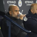
              Manchester City's head coach Pep Guardiola sits on the bench before the English FA Cup 4th round soccer match between Manchester City and Arsenal at the Etihad Stadium in Manchester, England, Friday, Jan. 27, 2023. (AP Photo/Dave Thompson)
            