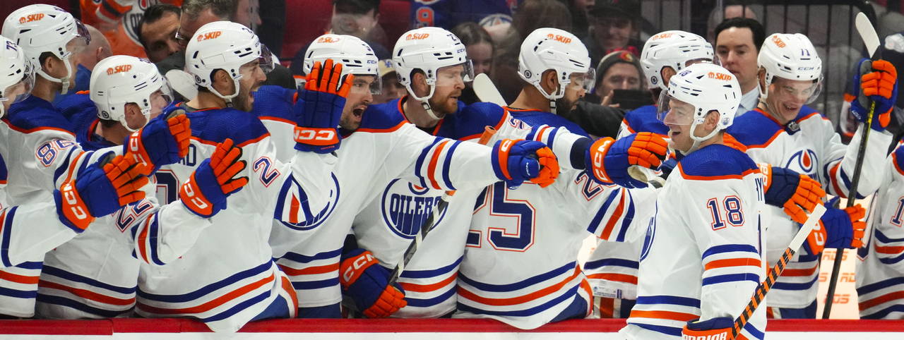 Edmonton Oilers left wing Zach Hyman (18) celebrates a goal with teammates on the bench during the ...