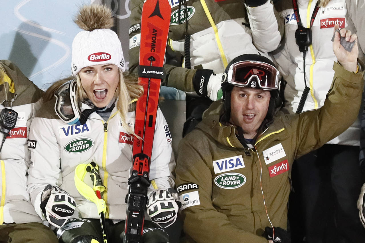 FILE - United States' Mikaela Shiffrin sits next to coach Mike Day, in Zagreb, Croatia, on Jan. 4, ...