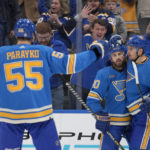 
              St. Louis Blues' Ryan O'Reilly (90) is congratulated by teammates Colton Parayko (55) and Pavel Buchnevich (89) after scoring the game-winning goal during overtime of an NHL hockey game against the Arizona Coyotes Saturday, Feb. 11, 2023, in St. Louis. (AP Photo/Jeff Roberson)
            
