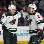 
              Minnesota Wild left wing Kirill Kaprizov celebrates with defenseman Calen Addison (2) after scoring a goal against the Arizona Coyotes in the second period during an NHL hockey game, Monday, Feb. 6, 2023, in Tempe, Ariz. (AP Photo/Rick Scuteri)
            