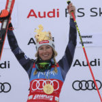 
              FILE - United States' Mikaela Shiffrin celebrates on the podium after winning  an alpine ski, women's World Cup giant slalom, her 83rd World Cup race, in Kronplatz, Italy, Tuesday, Jan. 24, 2023. Shiffrin isn't putting the same pressure on herself for the upcoming world championships, starting on on Feb. 6, 2023 in Courchevel and Meribel, France, that she did for last year's Beijing Olympics. The event is Shiffrin's first major championship since American skier didn't win a medal and didn't finish three of her five races at the Olympics.  (AP Photo/Alessandro Trovati, File)
            