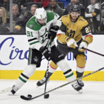 
              Dallas Stars center Tyler Seguin (91) skates with the puck against Vegas Golden Knights defenseman Shea Theodore during the first period of an NHL hockey game Saturday, Feb. 25, 2023, in Las Vegas. (AP Photo/David Becker)
            