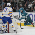 
              San Jose Sharks left wing Evgeny Svechnikov (10) passes the puck behind the goal during the first period of an NHL hockey game against the Buffalo Sabres in San Jose, Calif., Saturday, Feb. 18, 2023. (AP Photo/Jeff Chiu)
            