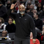 
              Washington Wizard head coach Wes Unseld Jr. signals to his team during the first half of an NBA basketball game against the Portland Trail Blazers in Portland, Ore., Tuesday, Feb. 14, 2023. (AP Photo/Steve Dykes)
            