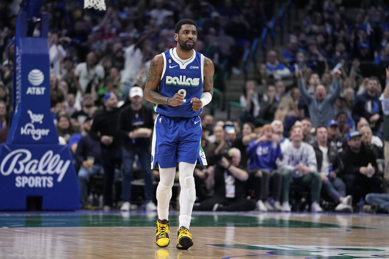Dallas Mavericks guard Kyrie Irving (2) celebrates after sinking a basket in the second half of an ...