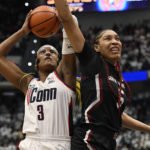 
              UConn's Aaliyah Edwards (3) shoots as South Carolina's Victaria Saxton (5) defends in the first half of an NCAA college basketball game, Sunday, Feb. 5, 2023, in Hartford, Conn. (AP Photo/Jessica Hill)
            
