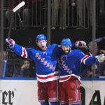 
              New York Rangers' Alexis Lafreniere, left, celebrates with Vincent Trocheck after Trochek scored his second goal of an NHL hockey game, during the second period, against the Los Angeles Kings Sunday, Feb. 26, 2023, in New York. (AP Photo/Frank Franklin II)
            