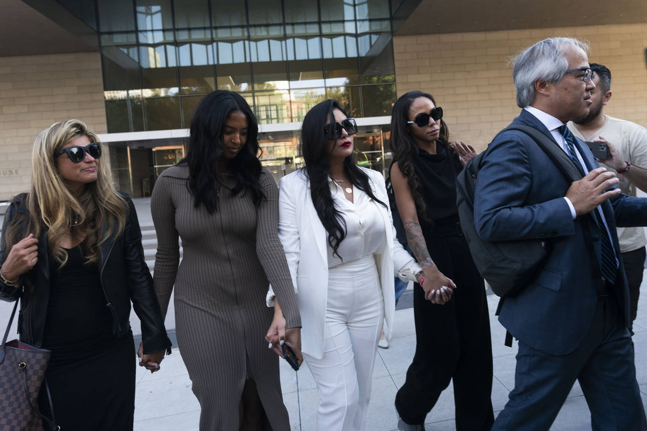 FILE - Vanessa Bryant, center, Kobe Bryant's widow, leaves a federal courthouse with her daughter N...
