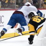 
              Pittsburgh Penguins' Sidney Crosby (87) trips Colorado Avalanche's Samuel Girard during the second period of an NHL hockey game in Pittsburgh, Tuesday, Feb. 7, 2023. (AP Photo/Gene J. Puskar)
            