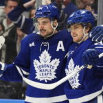 
              Toronto Maple Leafs' William Nylander (88) celebrates after his overtime goal against the Minnesota Wild with Auston Matthews (34) during NHL hockey game action in Toronto, Friday, Feb. 24, 2023. (Frank Gunn/The Canadian Press via AP)
            