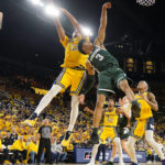 
              Michigan State guard Jaden Akins (3) loses control of the ball next to Michigan guard Jett Howard (13) during the first half of an NCAA college basketball game, Saturday, Feb. 18, 2023, in Ann Arbor, Mich. (AP Photo/Carlos Osorio)
            