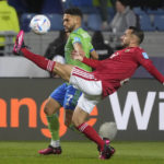 
              Al Ahly's Ali Maaloul, right, challenges for the ball with Cristian Roldan, of Seattle Sounders FC, during the FIFA Club World Cup soccer match between Seattle Sounders FC and Al Ahly FC at the Tangier stadium, in Tangier, Morocco, Saturday, Feb. 4, 2023. (AP Photo/Mosa'ab Elshamy)
            