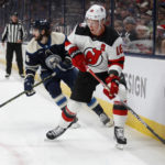 
              New Jersey Devils forward Ondrej Palat, right, controls the puck in front of Columbus Blue Jackets forward Kirill Marchenko during the first period of an NHL hockey game in Columbus, Ohio, Tuesday, Feb. 14, 2023. (AP Photo/Paul Vernon)
            