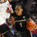 
              South Carolina guard Zia Cooke (1) drives against Mississippi guard Elauna Eaton (23) during the first half of an NCAA college basketball game in Oxford, Miss., Sunday, Feb. 19, 2023. (AP Photo/Rogelio V. Solis)
            