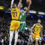 
              Boston Celtics guard Derrick White (9) shoots against Indiana Pacers center Daniel Theis (27) during the first half of an NBA basketball game in Indianapolis, Thursday, Feb. 23, 2023. (AP Photo/AJ Mast)
            