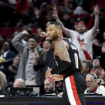 
              Portland Trail Blazers guard Damian Lillard, heads back up the court after scoring during the second half of an NBA basketball game against the Houston Rockets in Portland, Ore., Sunday, Feb. 26, 2023. (AP Photo/Steve Dykes)
            