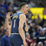 
              Denver Nuggets forward Michael Porter Jr. reacts after hitting a basket in overtime of an NBA basketball game against the Los Angeles Clippers Sunday, Feb. 26, 2023, in Denver. (AP Photo/David Zalubowski)
            