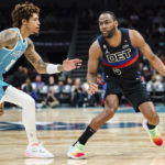 
              Charlotte Hornets guard Kelly Oubre Jr. (12) guards against Detroit Pistons guard Alec Burks (5) during the first half of an NBA basketball game in Charlotte, N.C., Monday, Feb. 27, 2023. (AP Photo/Jacob Kupferman)
            