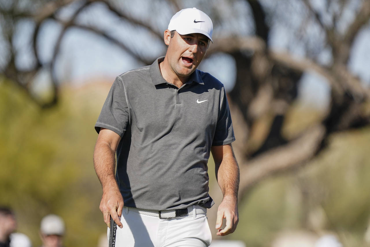 Scottie Scheffler reacts to missing a putt on the ninth hole during the third round of the Phoenix ...