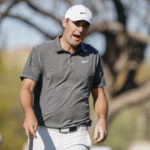 
              Scottie Scheffler reacts to missing a putt on the ninth hole during the third round of the Phoenix Open golf tournament, Saturday, Feb. 11, 2023, in Scottsdale, Ariz. (AP Photo/Darryl Webb)
            