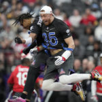 
              NFC tight end George Kittle (85) of the San Francisco 49ers celebrates a touchdown with NFC wide receiver Justin Jefferson of the Minnesota Vikings during the flag football event at the NFL Pro Bowl against the AFC, Sunday, Feb. 5, 2023, in Las Vegas. (AP Photo/John Locher)
            