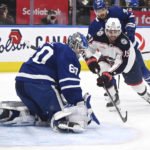 
              Toronto Maple Leafs goaltender Joseph Woll (60) makes a stop on Columbus Blue Jackets center Liam Foudy (19) during the first period of an NHL hockey game Saturday, Feb. 11, 2023, in Toronto. (Jon Blacker/The Canadian Press via AP)
            