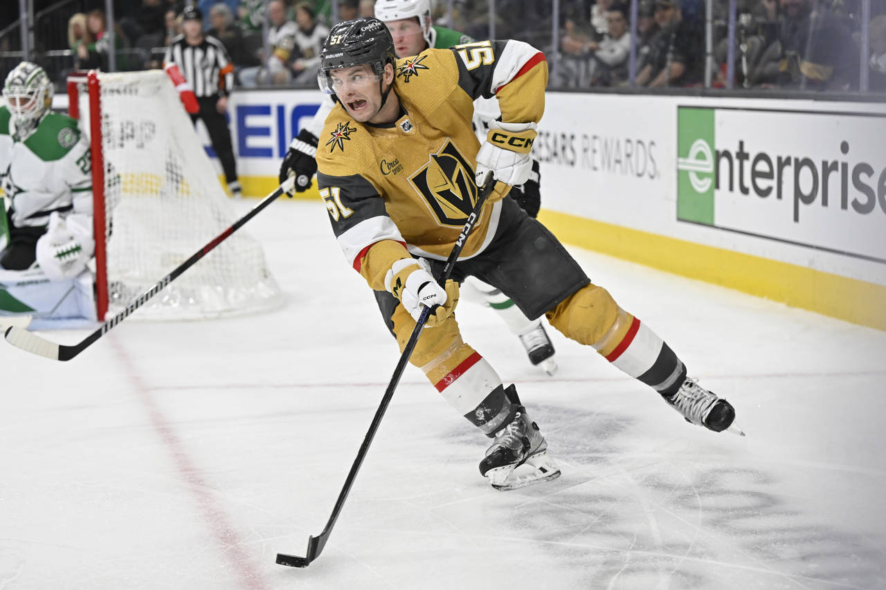 Vegas Golden Knights center Byron Froese (51) skates with the puck against the Dallas Stars during ...