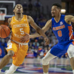 
              Tennessee guard Zakai Zeigler (5) drives against Florida guard Myreon Jones (0) during the first half of an NCAA college basketball game, Wednesday, Feb. 1, 2023, in Gainesville, Fla. (AP Photo/Alan Youngblood)
            
