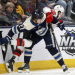 
              Columbus Blue Jackets defenseman Adam Boqvist, left, checks New Jersey Devils forward Erik Haula during the first period of an NHL hockey game in Columbus, Ohio, Tuesday, Feb. 14, 2023. (AP Photo/Paul Vernon)
            