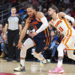
              New York Knicks guard Jalen Brunson has the ball knocked away from Atlanta Hawks guard Trae Young during the second half of an NBA basketball game, Wednesday, Feb. 15, 2023, in Atlanta. (AP Photo/Hakim Wright Sr.)
            