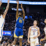 
              Golden State Warriors forward Andrew Wiggins (22) takes a 3-point shot in front of Oklahoma City Thunder guard Josh Giddey (3) during the first half of an NBA basketball game in San Francisco, Monday, Feb. 6, 2023. (AP Photo/John Hefti)
            