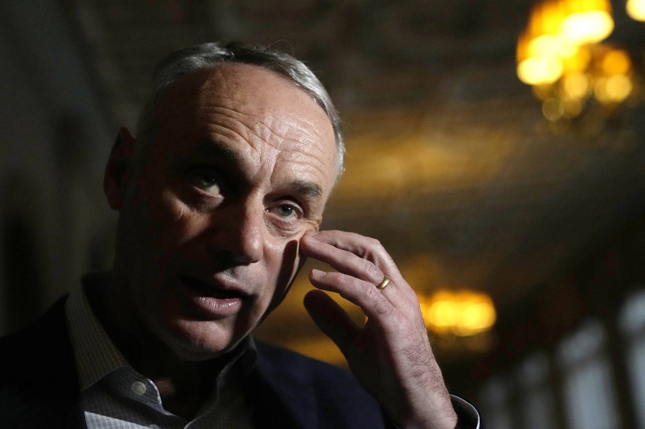 Major League Baseball Commissioner Rob Manfred speaks with the news media after a meeting of MLB ow...