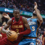 
              Cleveland Cavaliers guard Caris LeVert (3) drives against Detroit Pistons guard Alec Burks (5) during the second half of an NBA basketball game, Wednesday, Feb. 8, 2023, in Cleveland. (AP Photo/Ron Schwane)
            