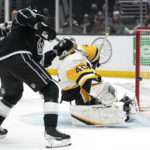 
              Los Angeles Kings right wing Adrian Kempe, left, scores on Pittsburgh Penguins goaltender Dustin Tokarski for his third goal of the game for a hat trick during the second period of an NHL hockey game Saturday, Feb. 11, 2023, in Los Angeles. (AP Photo/Mark J. Terrill)
            
