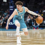 
              Charlotte Hornets guard LaMelo Ball brings the ball up court during the second half of an NBA basketball game against the Detroit Pistons in Charlotte, N.C., Monday, Feb. 27, 2023. (AP Photo/Jacob Kupferman)
            