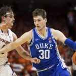 
              Duke's Kyle Filipowski (30) defends the ball against Virginia's Ben Vander Plas (5) during the first half of an NCAA college basketball game in Charlottesville, Va., Saturday, Feb. 11, 2023. (AP Photo/Mike Kropf)
            