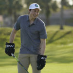 
              Dallas Star left wing Jason Robertson smiles after hitting his second shot with a hockey stick during a golf skills competition, Wednesday, Feb. 1, 2023, in Plantation, Fla. The event was part of the NHL All Star weekend. (AP Photo/Marta Lavandier)
            