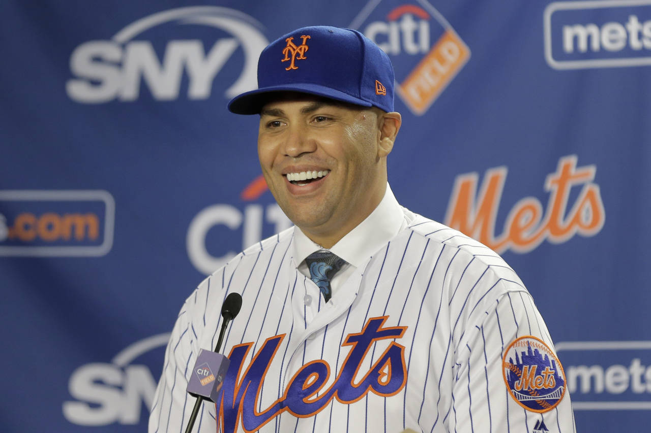 FILE - New York Mets' Carlos Beltran smiles during an introductory baseball news conference in New ...