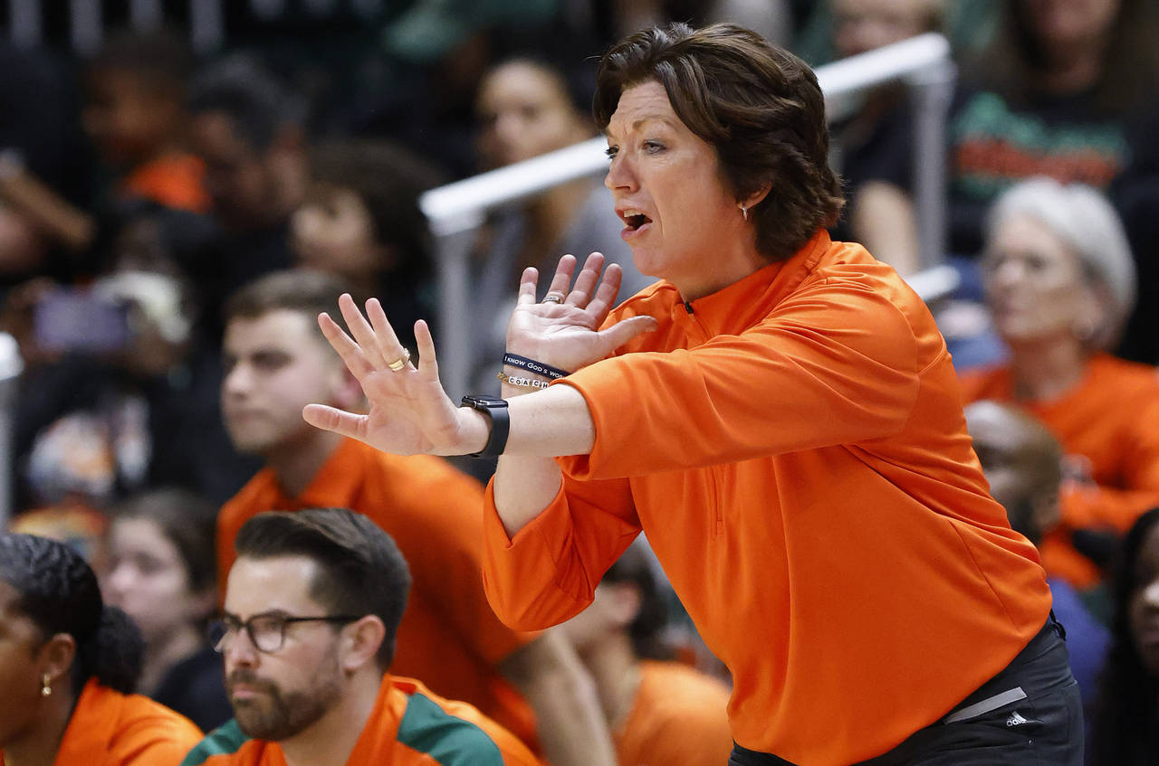 FILE - Miami head coach Katie Meier yells during the second half of an NCAA college basketball game...