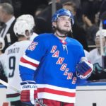
              New York Rangers' Ryan Lindgren (55) reacts after scoring an empty-net goal during the third period of an NHL hockey game against the Seattle Kraken, Friday, Feb. 10, 2023, in New York. (AP Photo/Frank Franklin II)
            