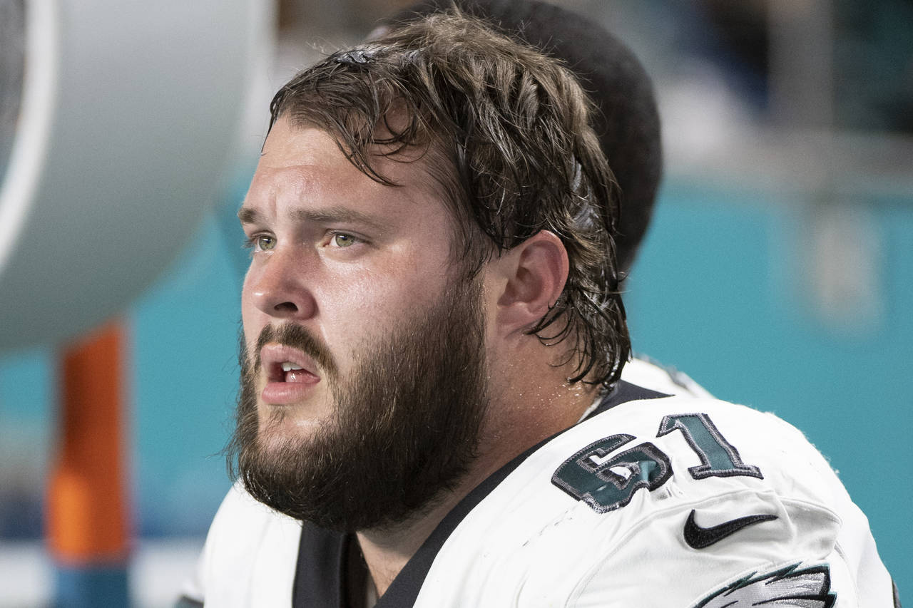 FILE - Philadelphia Eagles guard Josh Sills (61) sits on the sidelines during an NFL football game ...