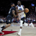 
              Golden State Warriors forward Draymond Green drives to the basket past Portland Trail Blazers guard Gary Payton II during the first half of an NBA basketball game in Portland, Ore., Wednesday, Feb. 8, 2023. (AP Photo/Craig Mitchelldyer)
            